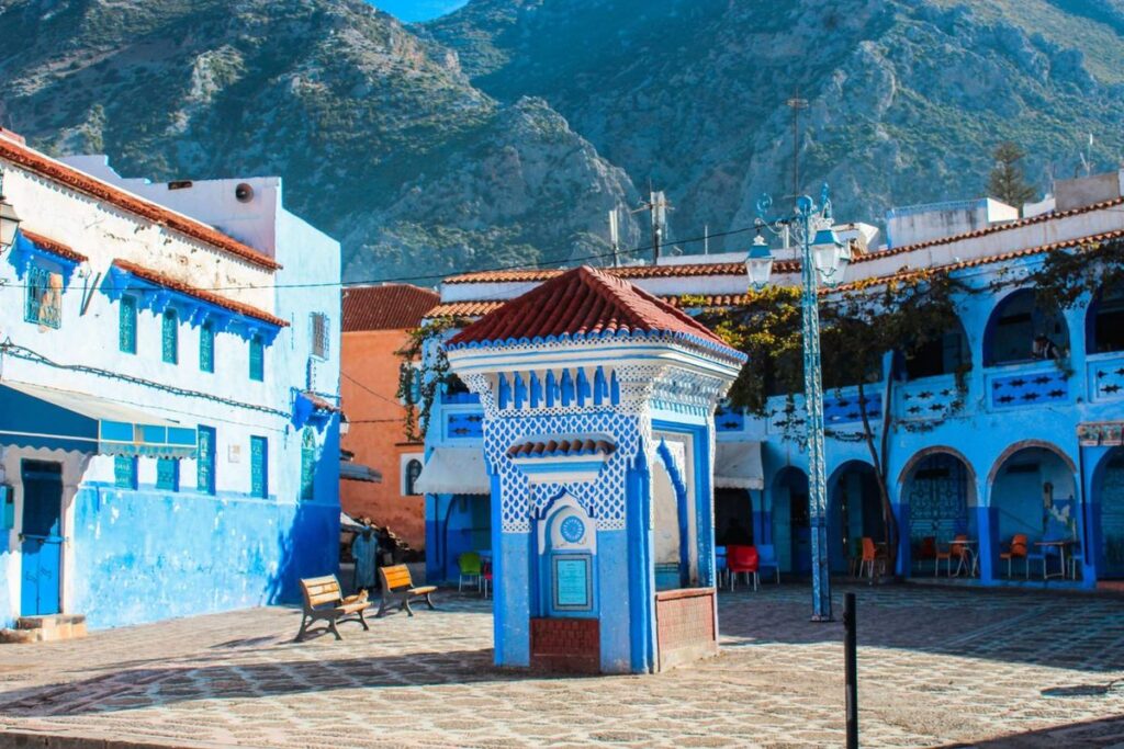traditional blue and white fountain in Chefchaouen medina Morocco